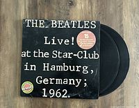 Black cover sleeve of The Beatles Live! at the Star-Club in Hamburg, Germany; 1962 with two vinyl records partially visible.