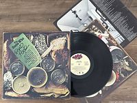 Photo showing The Guess Who Road Food vinyl LP, album cover, and inner sleeve with visible printed lyrics/modules.