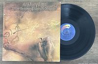 Photo of The Moody Blues vinyl album 'To Our Childrens Childrens Children' with cover and record visible.