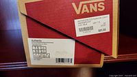 Photo of the Vans shoebox with label showing the brand, model, size, and price