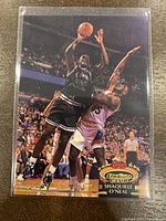 Front of the Shaquille O'Neal 1992-93 Topps Stadium Club Members Choice basketball rookie card showing action image and logos.