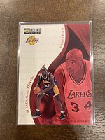 Front of 1997-98 Upper Deck Collectors Choice Shaquille O'Neal Hot Properties Card with dual images of Shaq in Lakers uniform, card number 368.