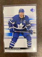 Front of 2019-20 Upper Deck SP John Tavares Blue Parallel Hockey Card #71 showing John Tavares in blue Toronto Maple Leafs uniform, with SP logo in top right.