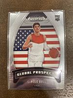 Front view of the 2020 Panini Prizm LaMelo Ball rookie card featuring a photo of LaMelo Ball with an American flag background and card details.