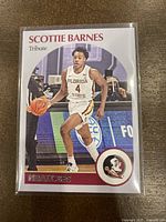 Front of Scottie Barnes basketball card in protective sleeve, showing player in Florida State uniform with card number 57 and branding.