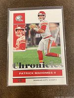 Front view of 2021 Panini Chronicles Patrick Mahomes football card with images and printed text.