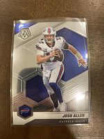 Front side of the Josh Allen football card showing player in action with hexagonal backdrop and Buffalo Bills logo.