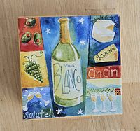 Close-up photo of original box with colorful wine and cheese themed artwork