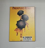 Full view of the plaque mounted on a grey wall showing overall condition and design.