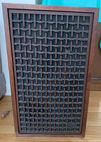 Front view: wooden lattice grille over speaker cloth