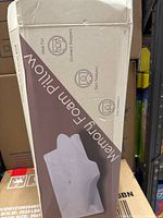 Box packaging showing memory foam pillow for stomach, back, and side sleepers