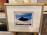 Full view of framed lithograph "Pic Island" by Lawren Harris, showing stylized island and sky.