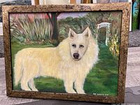 Full view of oil painting showing white dog in garden setting, signed M Hadley, framed