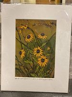 Photo of an 8x10 floral print depicting yellow flowers with brown centers and green stems, signed by Sarah Hale, mounted on white mat board.
