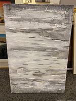 Full view of a 24x36 inch abstract textured painting in black, white, and gray tones.