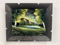 Frontal view of velvet painting in carved wood frame showing full artwork and frame design.