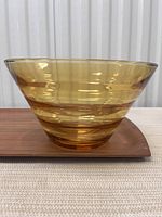Side view of amber glass bowl showing shape and transparency