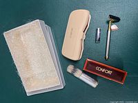 Complete grooming set with original box, razor, blade, brush and packaging foam visible