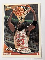 Front of 1993 Michael Jordan basketball card showing action photo of Jordan dunking with Bulls #23 jersey.