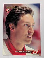 Full front view of the hockey card showing Wayne Gretzky's face in profile with Wien 96 gold foil text and logos.