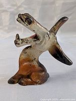 Side view of the laughing donkey bottle opener showing the open mouth and painted details