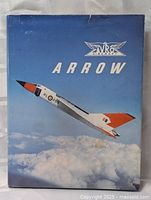Front cover of the AVRO Arrow hardcover book showing a photo of the aircraft in flight with the AVRO Aircraft logo and 'ARROW' title.