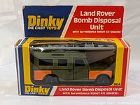 Front view of the Dinky die cast Land Rover Bomb Disposal Unit in original box showing logo, product name and item inside with Surveillance Robot Kit.