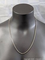 Sterling silver Italian chain necklace displayed on black mannequin bust showing front view of chain length and thickness.