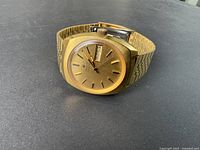 Front-angled view of watch showing dial, case and bracelet.