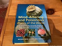 Front cover of book 'Mind-Altering and Poisonous Plants of the World' showing images of toxic plants and title.