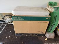 Tank lid on boxed American Standard Champion 4 tank