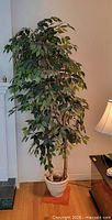 Full view of artificial ficus tree in pot