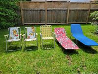 Group shot of all five folding aluminum outdoor seats on lawn
