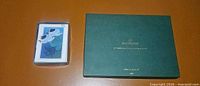 Boxed note cards beside green Cloverleaf box