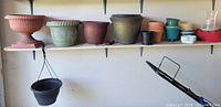Shelf showing majority of planters and urn