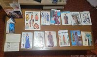 Overview of 14 pattern envelopes and Windmere shaver in bag on table