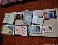 Top view of three stacks of assorted books on a table