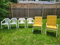six chairs lined up on lawn showing overall variety