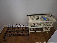 Overall lot: plastic shelf with lattice design, metal shoe rack, wooden shoe trees underneath