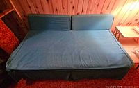 Full view of daybed opened flat with cushions