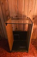 Cabinet front view showing open cubby and glass top