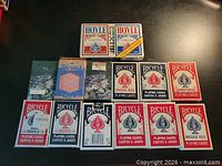 All 14 decks arranged on table showing brand, size and packaging