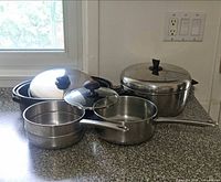 Group shot of all cookware items and lids