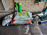 Group shot showing all bags, fertilizer bottle and insecticide spray