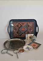 Group shot showing all items including both trays, bone china dish, porcelain pieces, magnifying glasses, coaster and ashtray