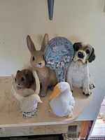 All six resin garden decor items grouped together