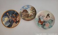 Front view of three decorative plates