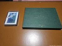 Green storage box and plastic-cased notecard set