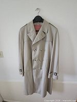 Front view showing overall coat design, color and button configuration