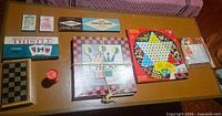 Overall view of all boxed games and accessories on table